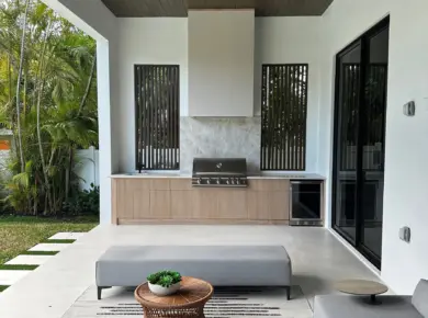 Covered patio outdoor kitchen with LIOHER weatherproof cabinetry, grill and beverage center