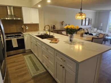 White shaker kitchen remodel with quartz island by Dreamery, South Florida