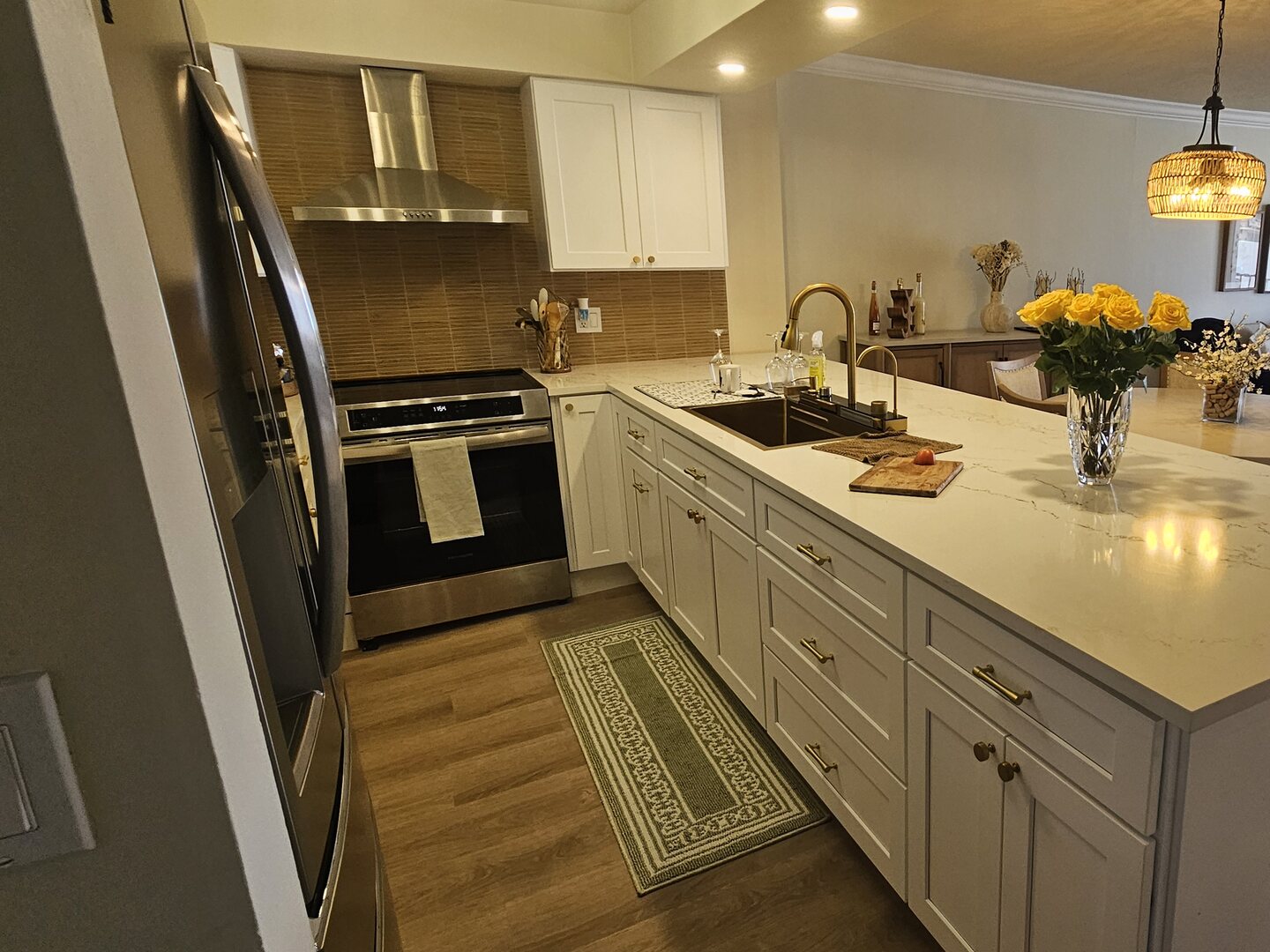 White Kitchen with Quartz Island — Dreamery Project — after remodel by Dreamery, South Florida